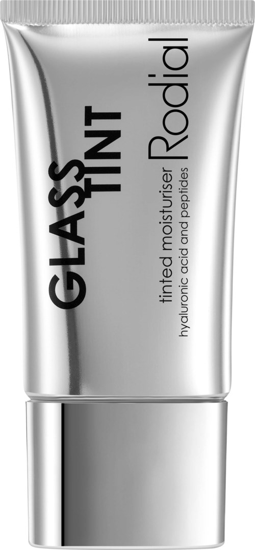 En sølvfarget tube med hudpleieprodukt merket 'GLASS TINT' og 'Radial' i mindre bokstaver. Den nevner fukt og peptidfordeler.