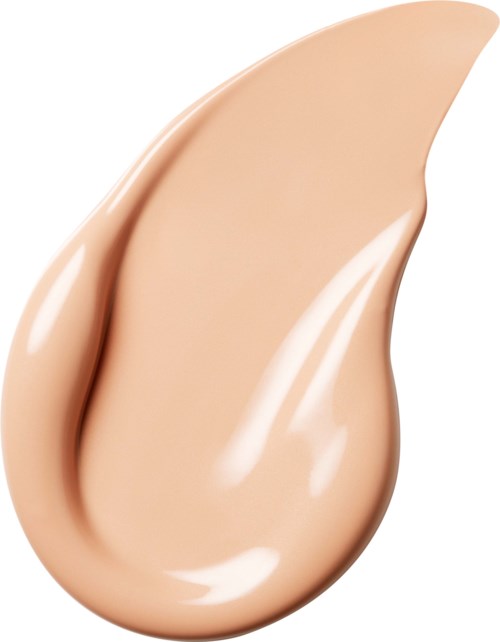 En beige væske eller lotion i dråpeform, shiny og glatt.