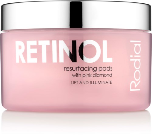 Pink jar of Retinol resurfacing pads with a silver lid, labeled for lifting and illuminating skin.