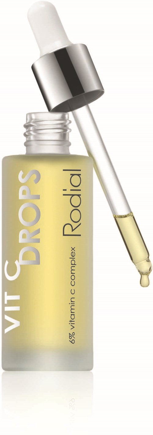 A bottle with a dropper, labeled healthy vitamins for glowing skin, shows yellow liquid inside.