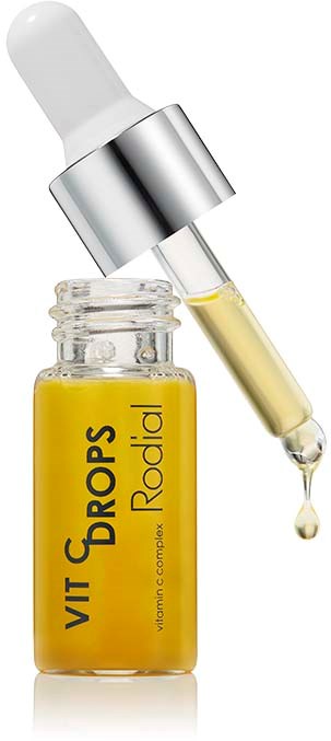 Een klein glazen flesje met gele vloeistof en een pipet. Het label zegt 'VIT Drops Rodial'.