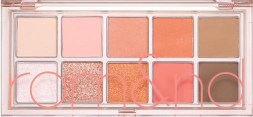 Eine Palette mit zwölf Lidschatten in einer transparenten Hülle, mit Farben wie Rosa, Pfirsich, Braun und Glitzer.