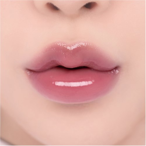 Close-up of lips with clear, glossy pink lipstick and smooth skin around.