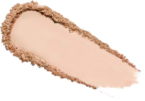 Ett ljusbeige pulver med en något mörkare kant, utbrett på en vit bakgrund.