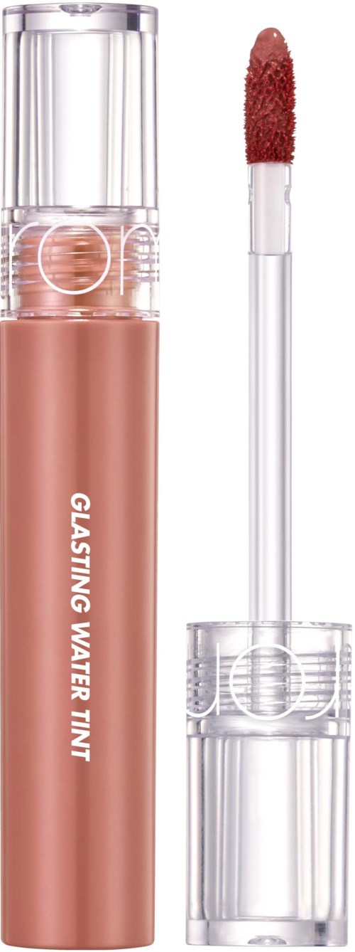 A lip gloss with a pinkish shade, clear cap, and a wand applicator next to it.