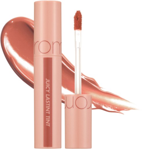Lippenstift mit Applikator, auf einem glänzenden, pfirsichfarbenen Schlieren.