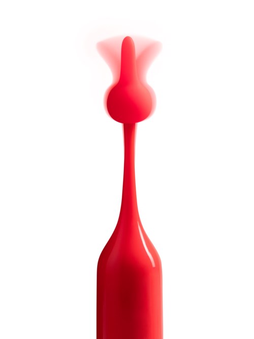 Ein rotes Gummiobjekt mit langem schmalem Stiel und runder Spitze, aus dem Dampf oder Rauch aufsteigt.