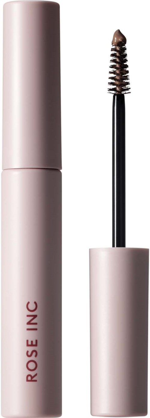 Ein Mascara-Röhre mit Bürstchen, beschriftet 'ROSE INC,' zeigt die Verwendung von Mascara.