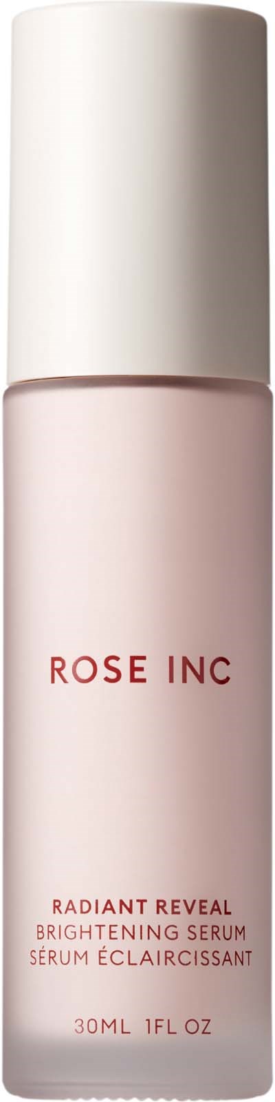 En liten, lys rosa flaske med hvit lokk, merket 'ROSE INC' og 'Brightening Serum'.