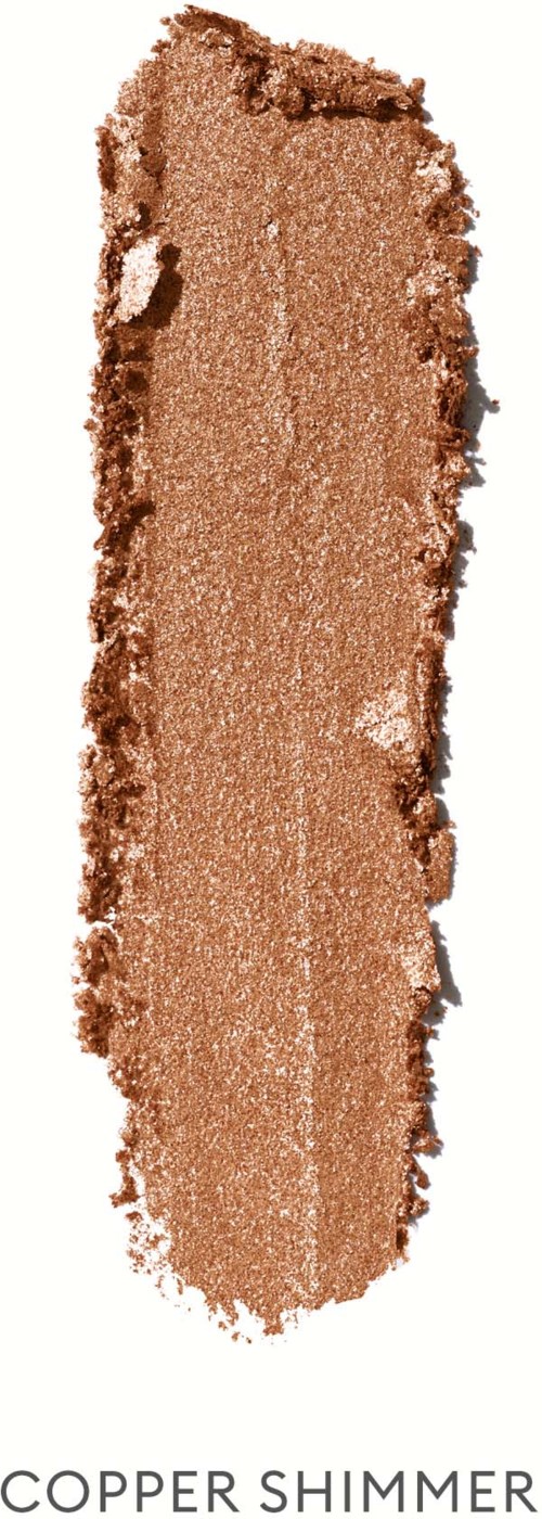 A swatch of copper shimmer eyeshadow with a shiny, metallic finish and textured edges.