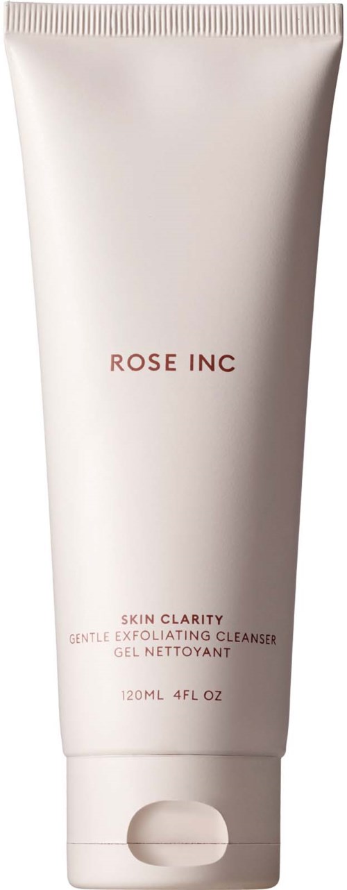 Een witte tube met 'Rose Inc' in roze tekst voor een huid exfoliërende gelreiniger.