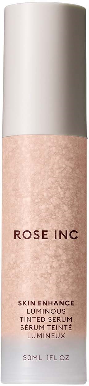 A product bottle with a white cap and pinkish label, named Rose Inc, for skin serum.