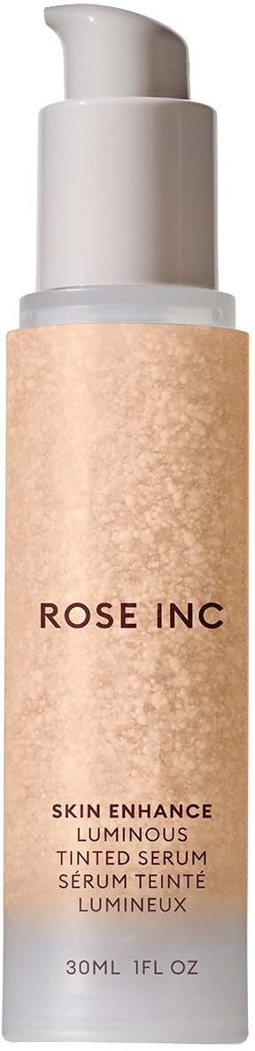 A bottle of skincare serum labeled Rose Inc, with a pump, pinkish-beige color, and 30ml volume.