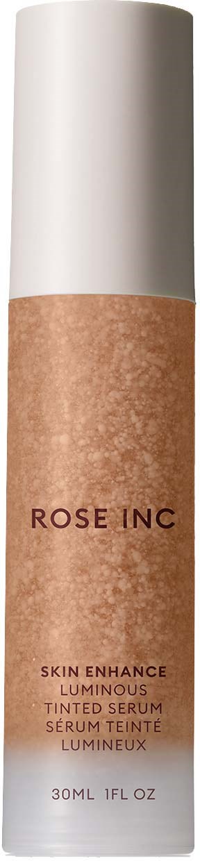 A tall bottle with a white cap, brown body, and label stating "ROSE INC." for a skin serum.