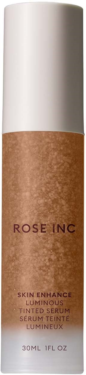 A bottle with a beige-colored liquid label and a white cap, labeled "ROSE INC" for skincare product.