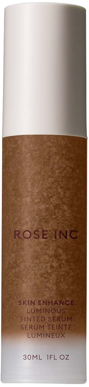 A brown serum bottle with white cap and purple text, labeled "Rose Inc" and "Skin Enhance Luminous Tinted Serum."