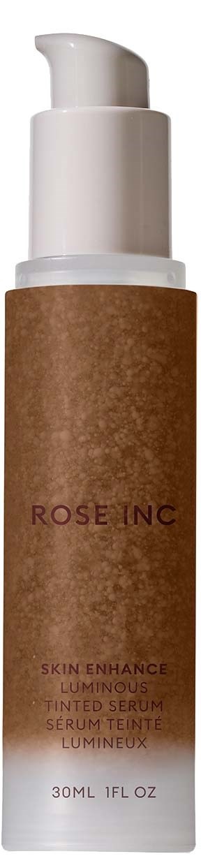 A bottle with a white pump and a brown label that says Rose Inc, containing a skin serum.