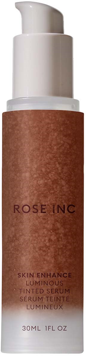 A brown bottle with a white pump cap, labeled 'ROSE INC' and 'Skin Enhance Luminous Tinted Serum.'
