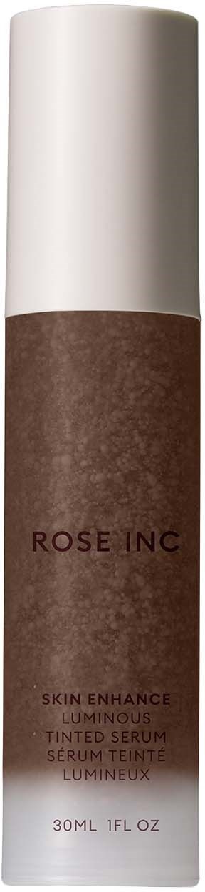 A brown tinted serum bottle with a white cap labeled 'ROSE INC' and product details.