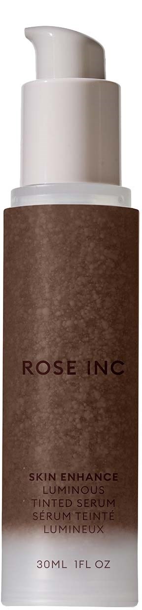A brown and white bottle with a pump, labeled 'ROSE INC' and 'Skin Enhance Luminous Tinted Serum'.