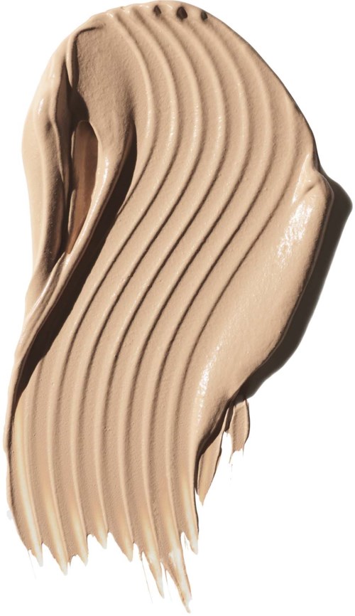 A smear of light brown or beige cream with wavy lines on a white background.