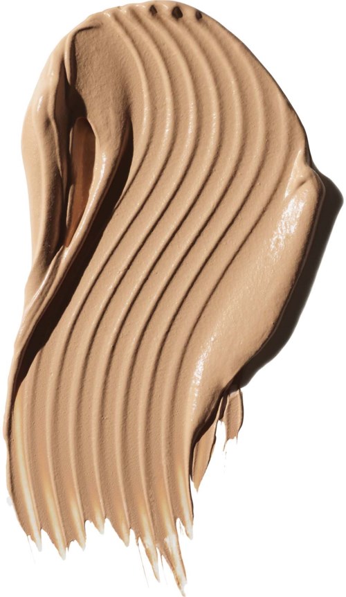 Swirling beige or tan cream spread with ridges, likely a cosmetic or skincare product.