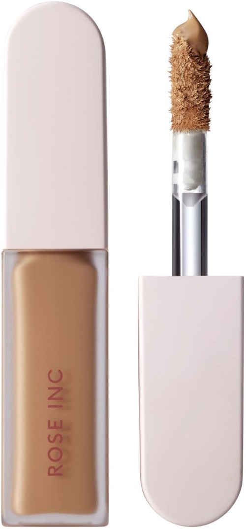 A nude liquid concealer with a wand applicator inside a pink case.