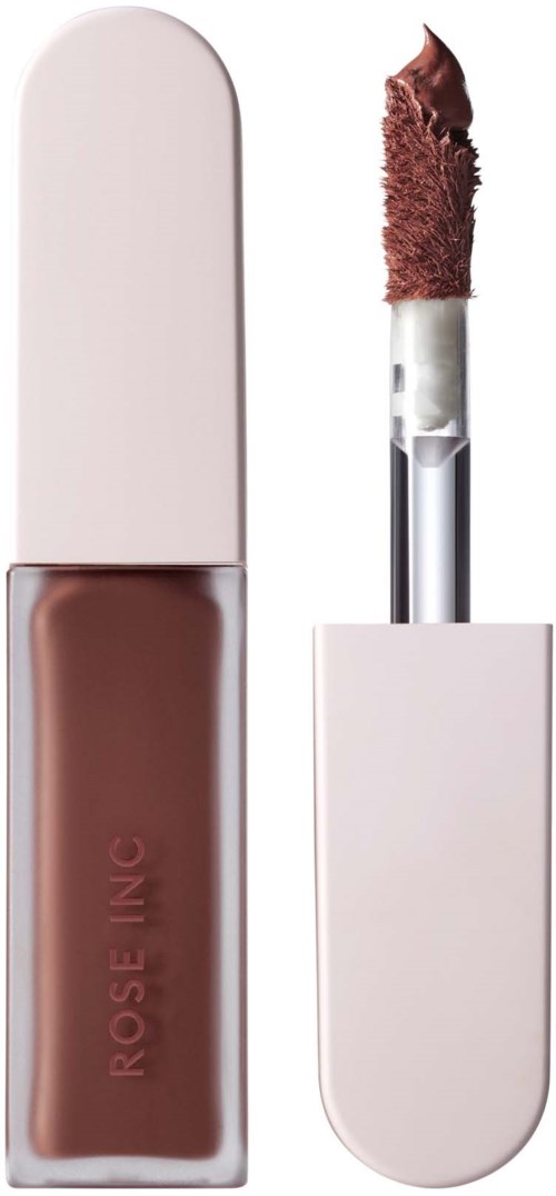 A lip gloss tube with brown lipstick spilled on the applicator, and a white cap attached.