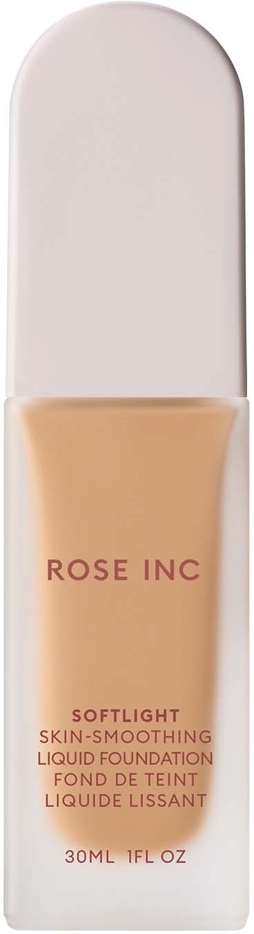 A foundation bottle labeled "ROSE INC" with a light beige liquid inside. The bottle is tall and white.