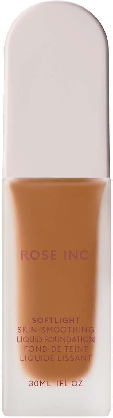 A makeup product in a tube, labeled 'Rose Inc', with a beige liquid inside.