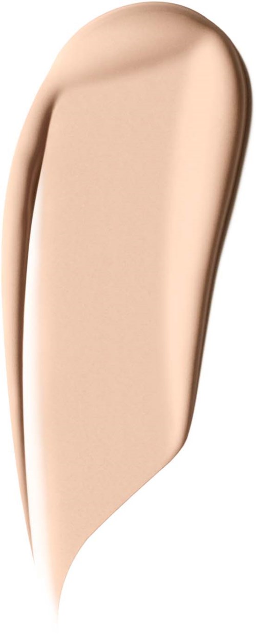A beige, elongated makeup applicator with a rounded top and flat bottom.