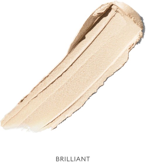A smear of creamy beige makeup product, likely foundation or concealer, on a white background.