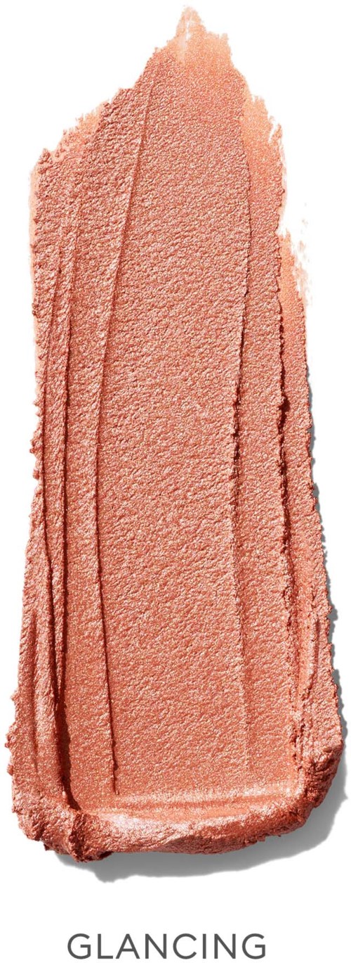A soft pinkish-orange makeup blush with textured lines and a smooth base.