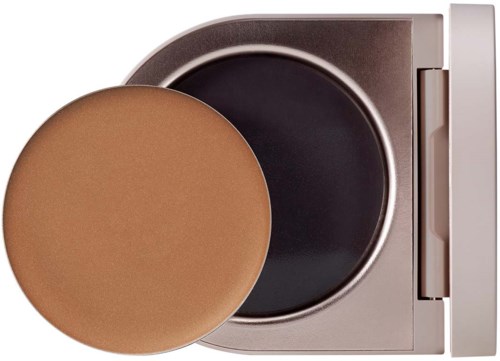 A compact makeup sponge and a container with a lid, likely for makeup or foundation.