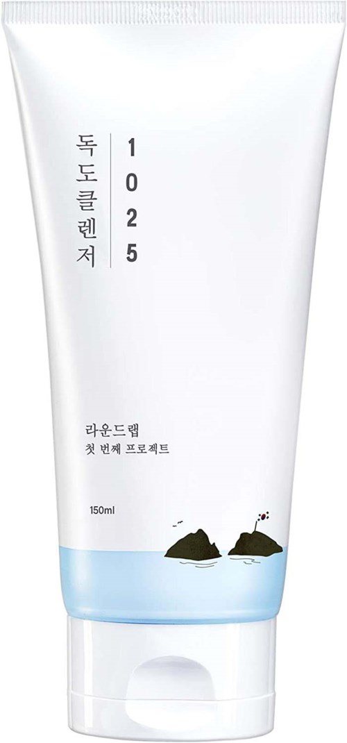 A white tube with Korean writing and a small illustration of two rocks and water at the bottom.