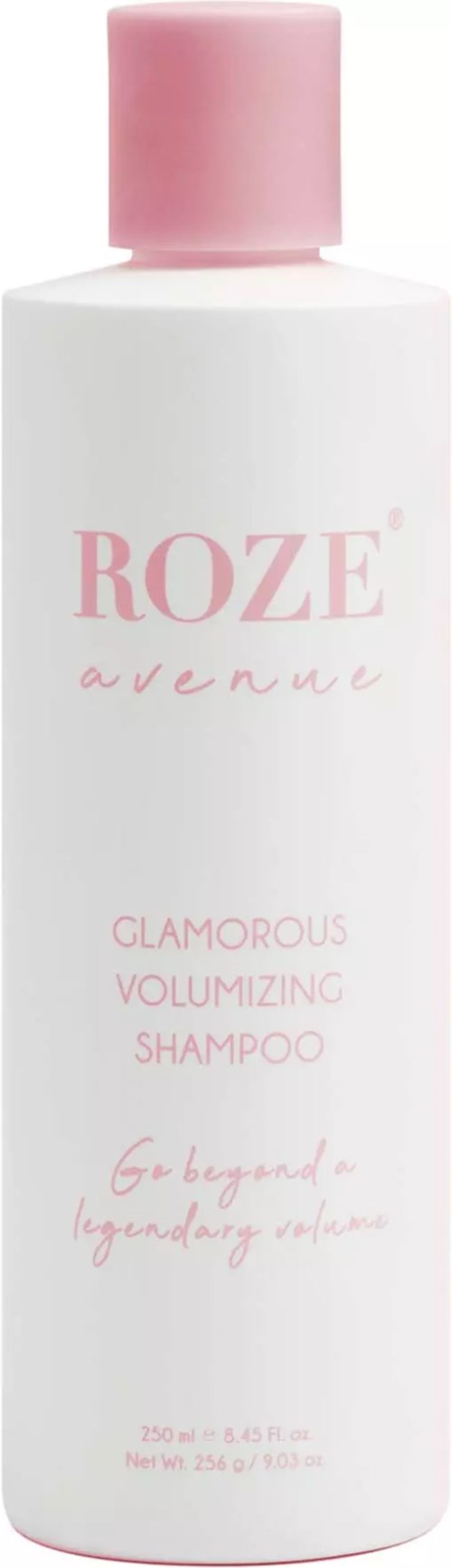 Eine rosa-weiße Flasche mit der Aufschrift 'ROZE avenue' für Shampoo, mit rosa Deckel, elegant und feminin gestaltet.