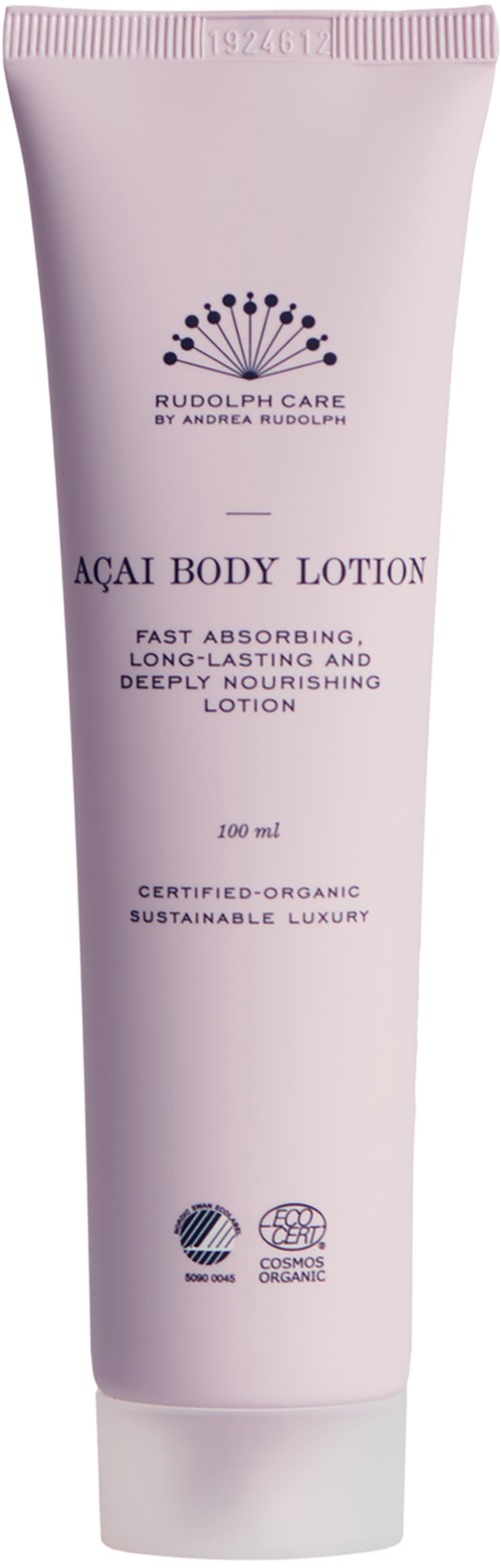 Biała tubka z napisem 'Açaí Body Lotion' z opisami jej pozytywnych cech i certyfikatów, stojąca.
