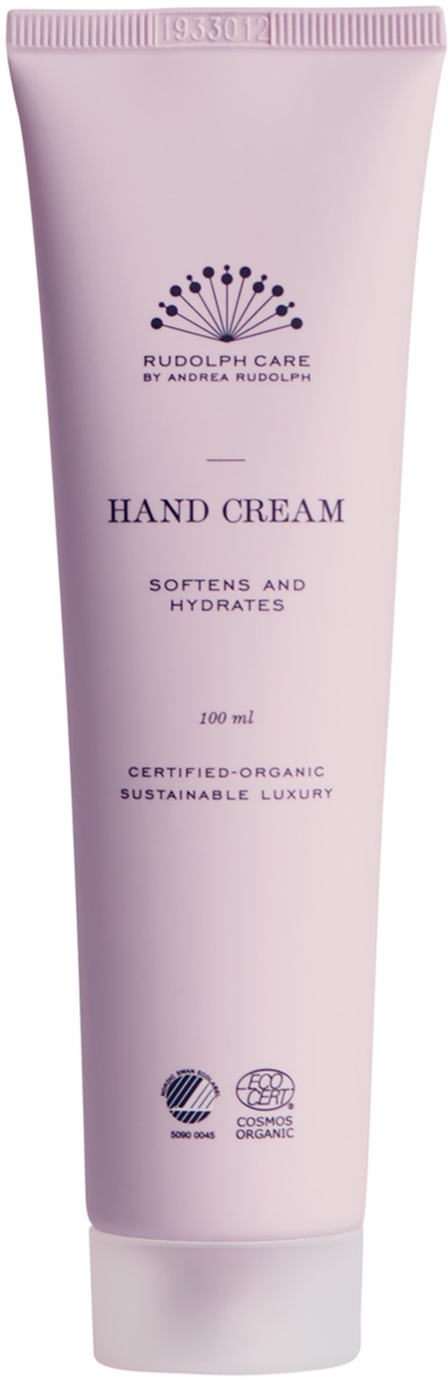 Pink tube of hand cream with text about softness, hydration, and organic certification.