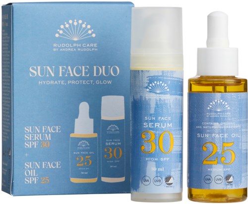 A blue box containing a sun face duo with sunscreen and oil, and bottles of face serum and oil with SPF labels.