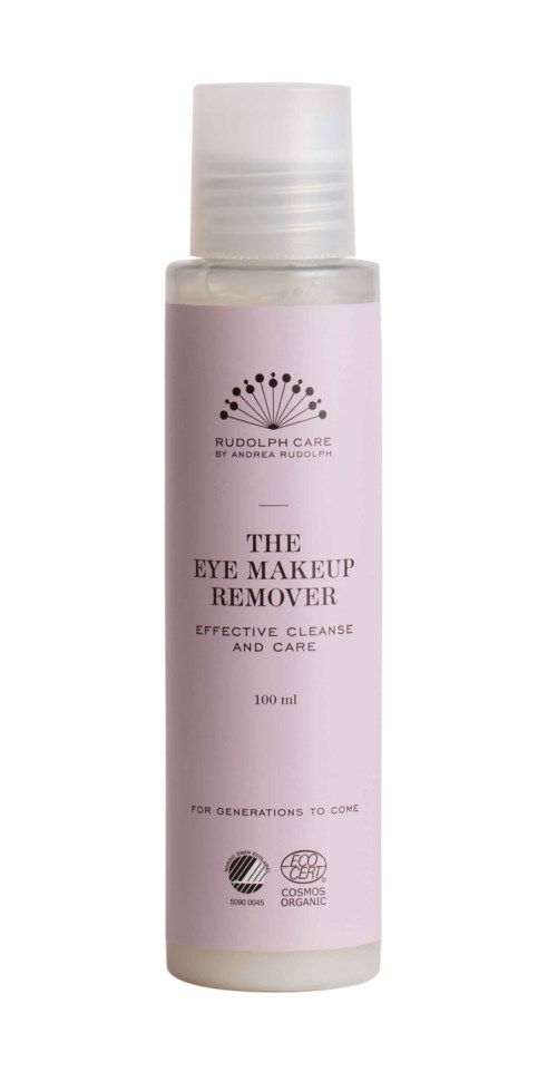 A small white bottle labeled 'The Eye Makeup Remover' from Rudolph Care, with a pink label and a white cap.