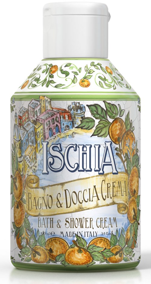 En vit flaska med färgglada illustrationer av stadshus, orange frukter och gröna blad, märkt 'Ischia Bath & Shower Cream.'