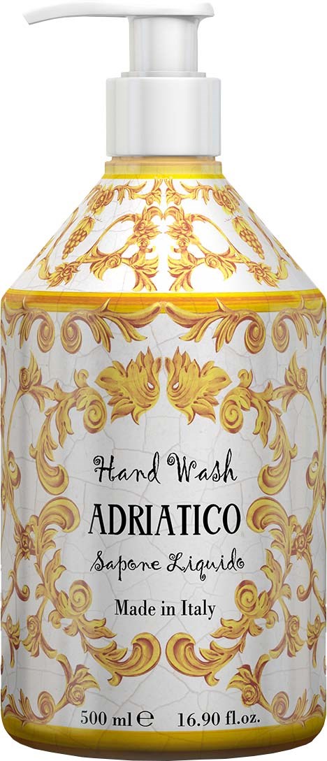 Valkoinen ja kultainen koristepullo, jonka etiketti lukee 'Hand Wash Adriatico' Italiasta, ja siinä on pumppu päässä.