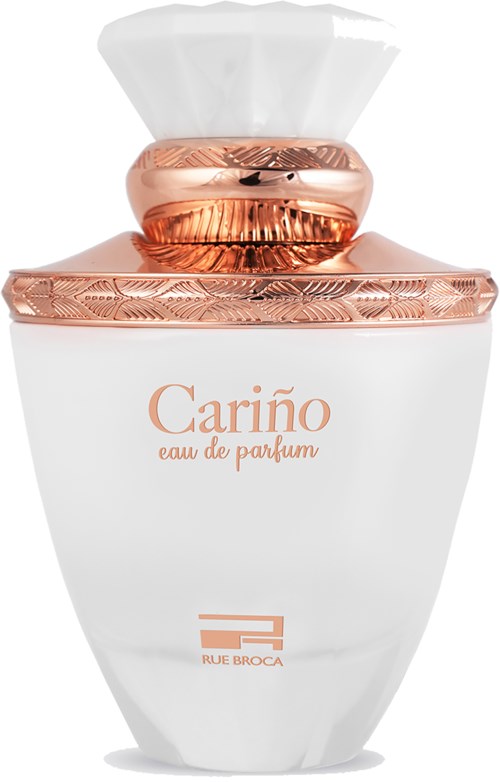 A white perfume bottle with a rose gold cap and details, labeled 'Cariño eau de parfum' and 'RUE BROCA' at the bottom.