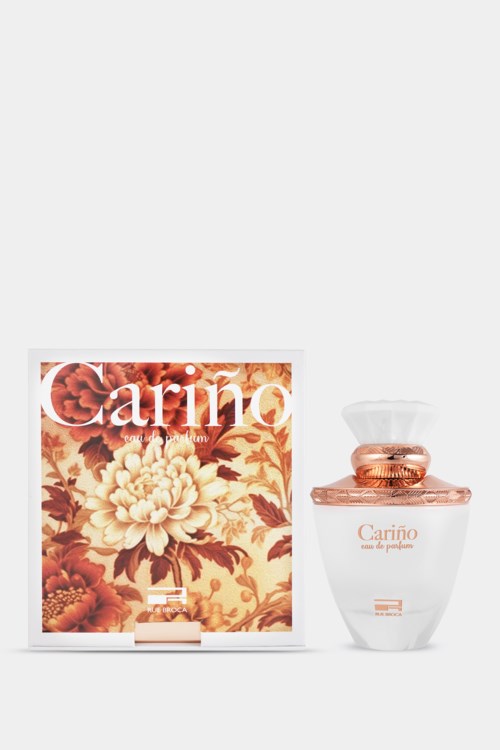 A perfume bottle and box with the word "Cariño" and floral design on the box.