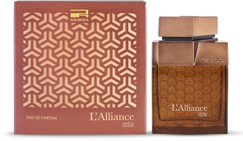 A perfume bottle and matching gift box with geometric and decorative designs, labeled 'L'Alliance stellar'.