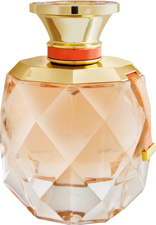 A stylish perfume bottle with a pink and gold design, faceted glass, and a gold cap.