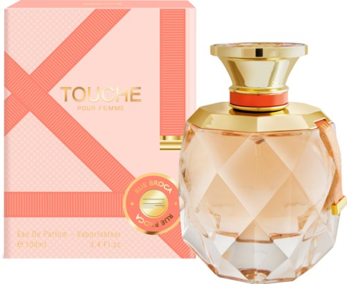 A perfume bottle with a pink and gold design, next to a matching pink box. The perfume is named 'Touche Pour Femme.'