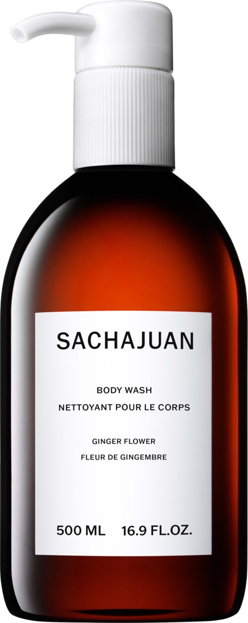Eine braune Körperwaschflasche mit weißem Pumpaufsatz und weißem Etikett mit Produktnamen und Details.