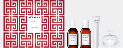 Een gezichtsverzorgingsset met een patroonbox, twee flessen, een tube en een kleine ronde container.