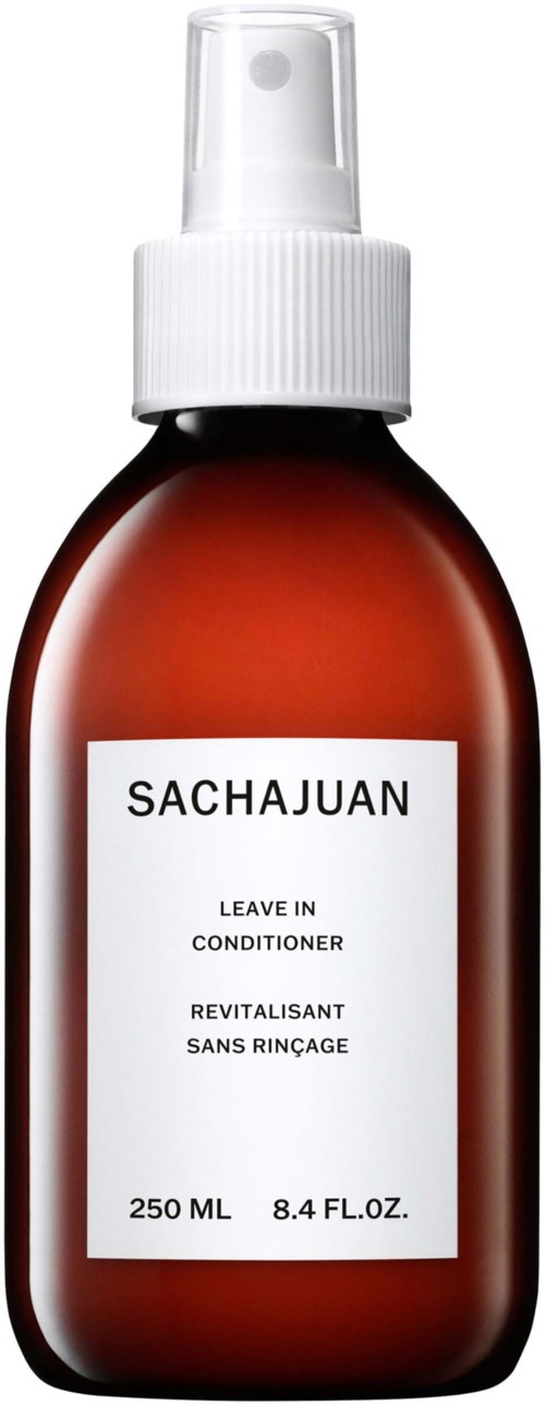 Braune Sprühflasche mit weißem Sprühkopf, beschriftet 'SACHAJUAN' und 'Leave In Conditioner'.